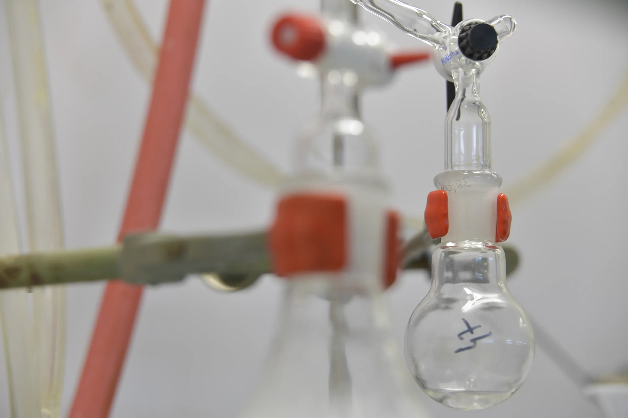 Glass reaction flask and clamps in the laboratory